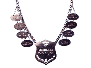 Sch&uuml;tzenkette, Handarbeit